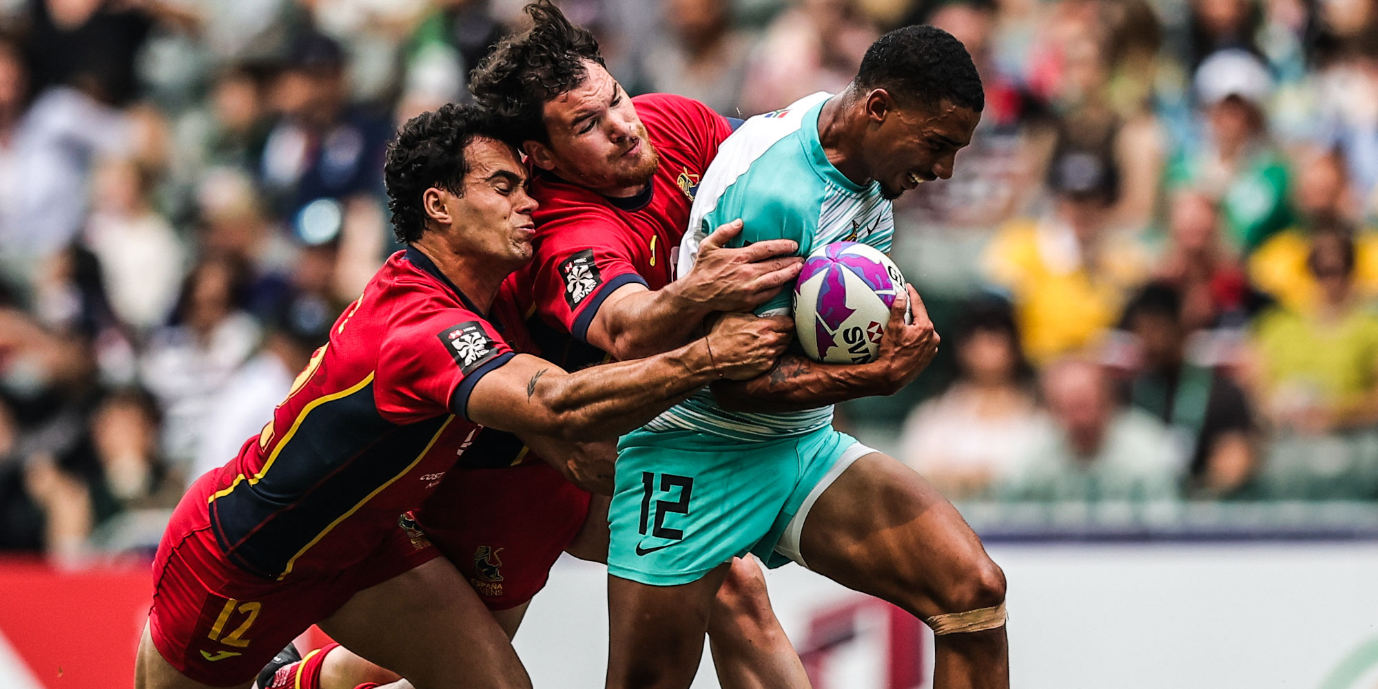 Shilton van Wyk keeps two Spanish defenders busy.