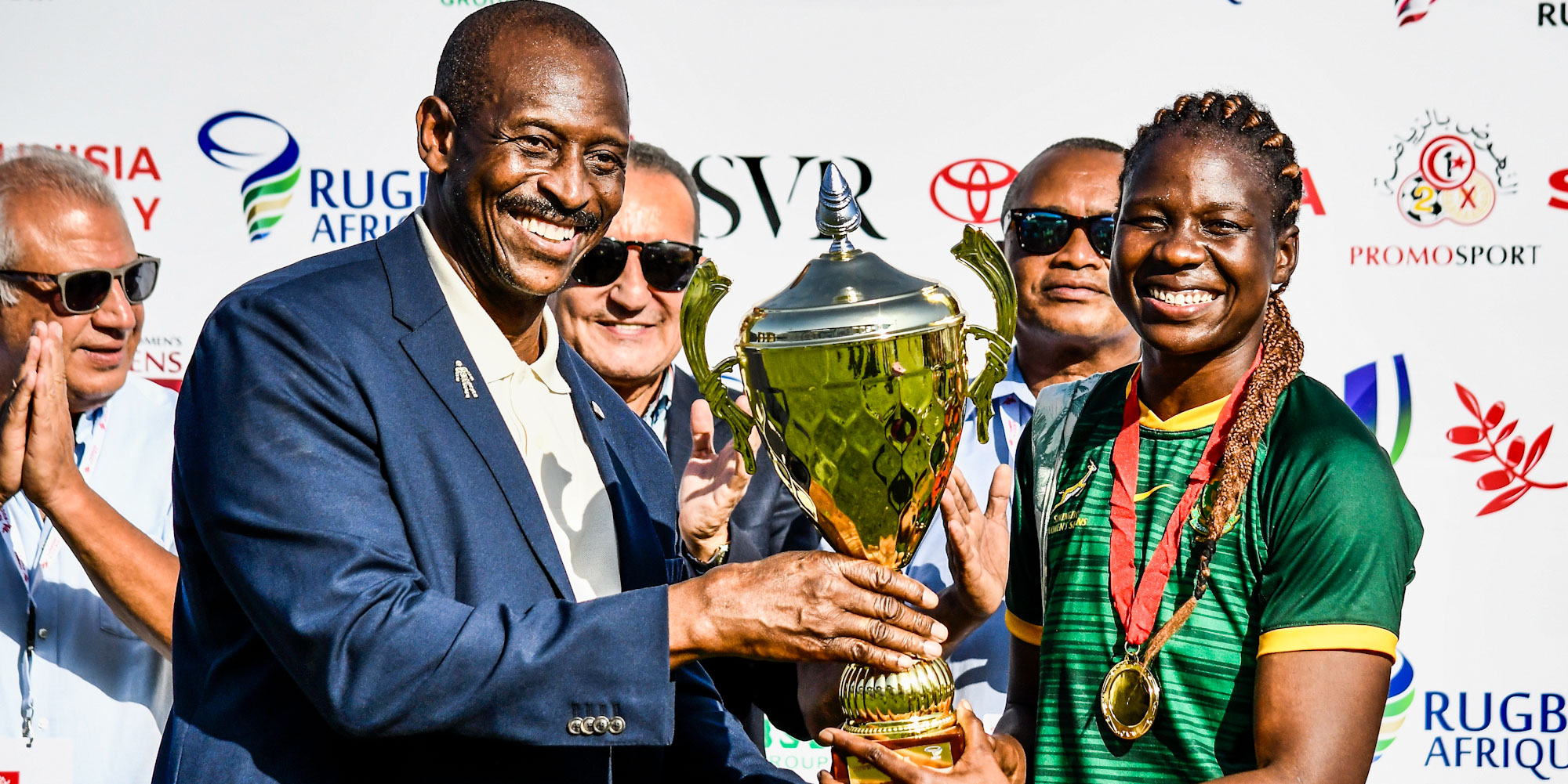 Rights Mkhari lifts the trophy in Tunisia.
