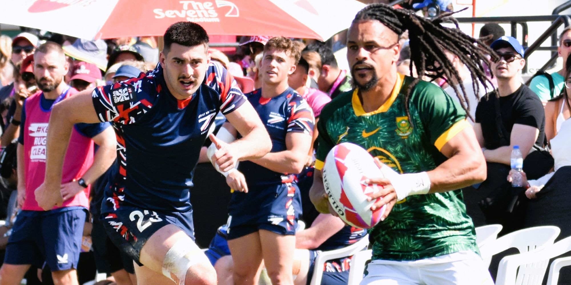 Selvyn Davids evades a defender from Great Britain.