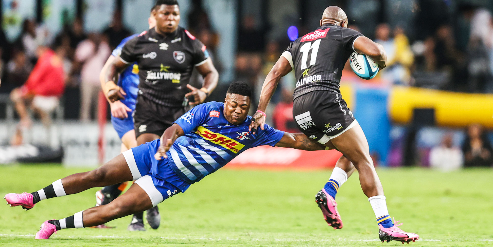 Wandisile Simelane of the DHL Stormers tries to stop Hollywoodbets Sharks speedster Makazole Mapimpi.