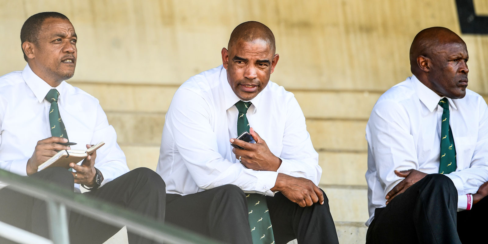 Eddie Myners (left) and Lungisa Kama (right) assist Stanley Raubenheimer with the Springbok Women's team.