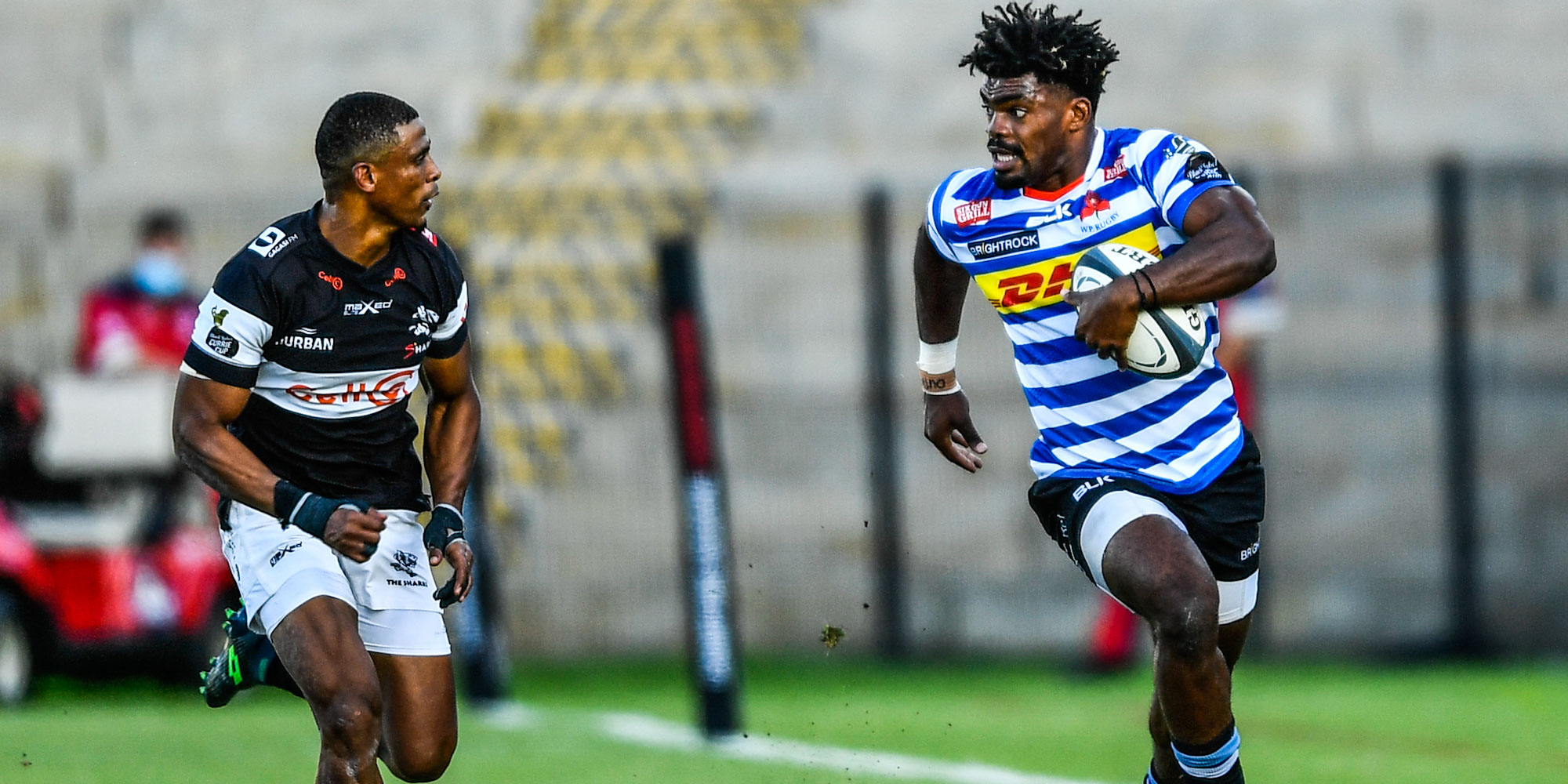Young DHL WP wing Ebenezer Tshimanga on another rampaging run against the Cell C Sharks.