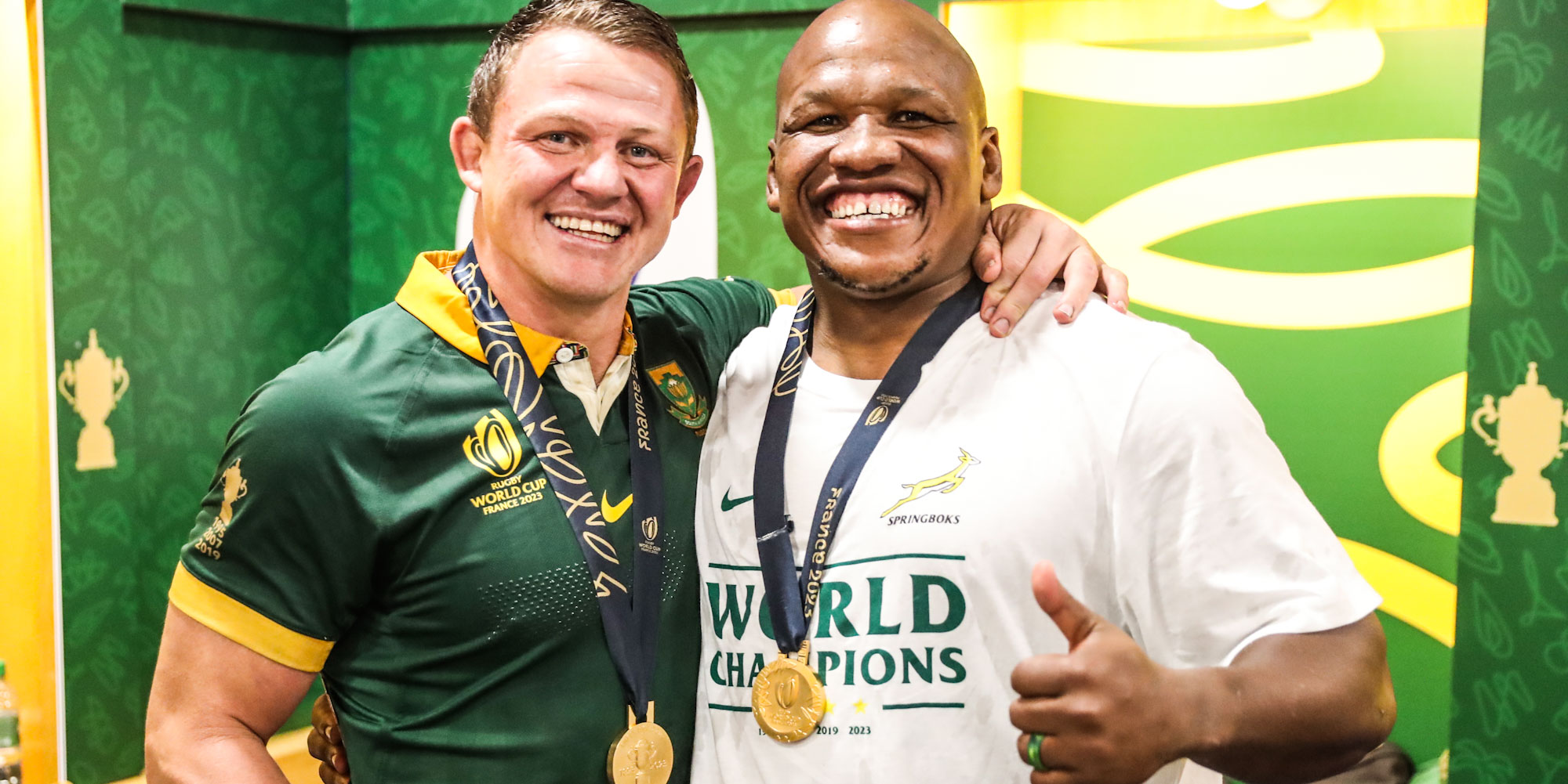 Deon Fourie and Bongi Mbonambi celebrate in the changeroom.