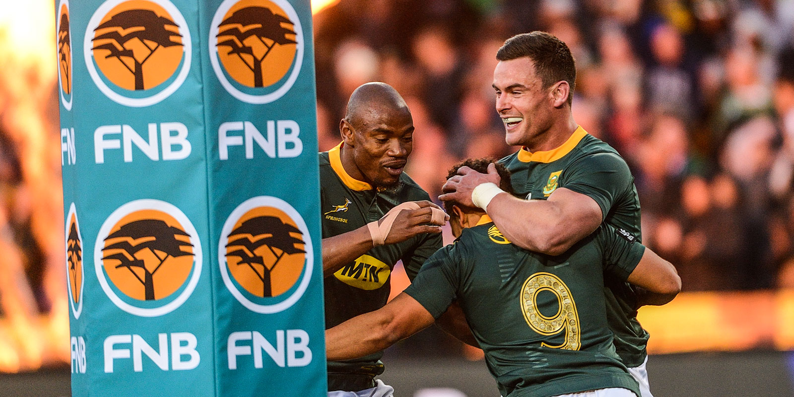Jesse Kriel and Makazole Mapimpi congratulate Herschel Jantjies on his first Test try in 2019.