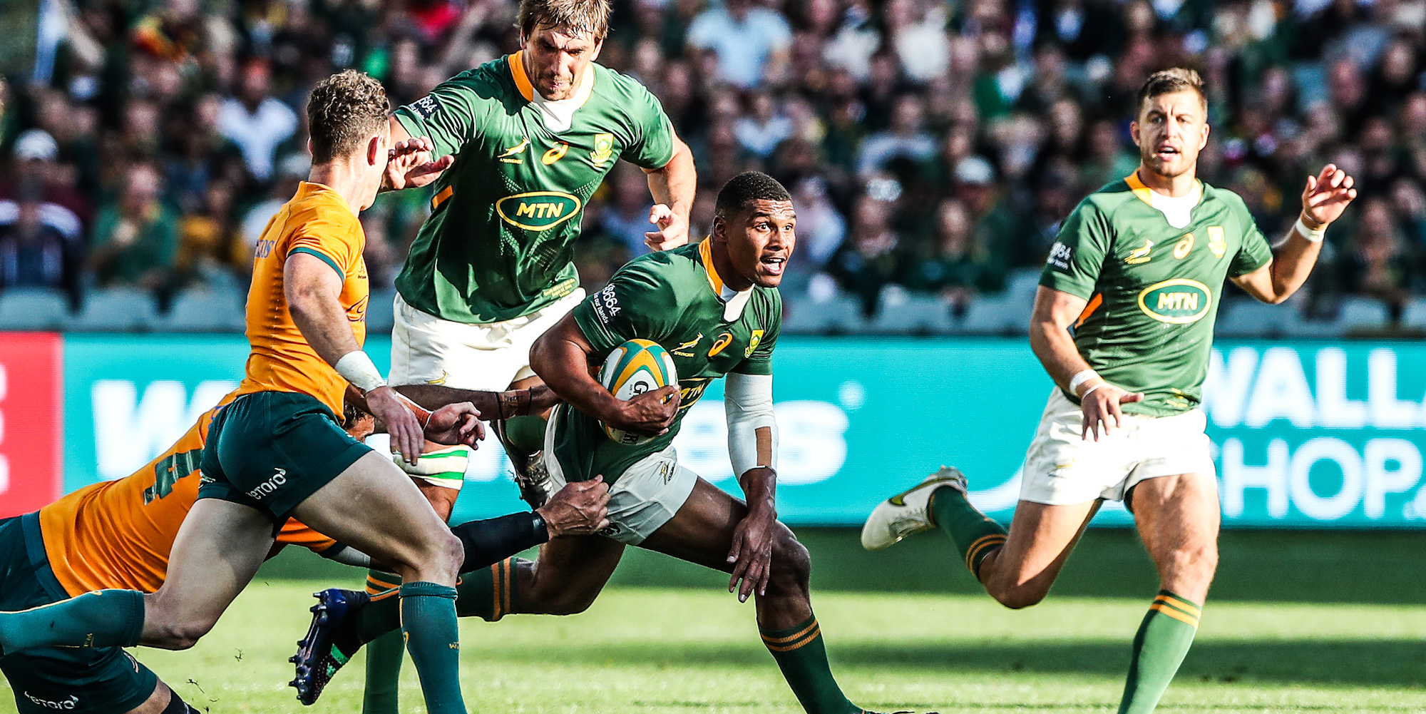 Damian Willemse looks for a gap with support from Eben Etzebeth and Handre Pollard.
