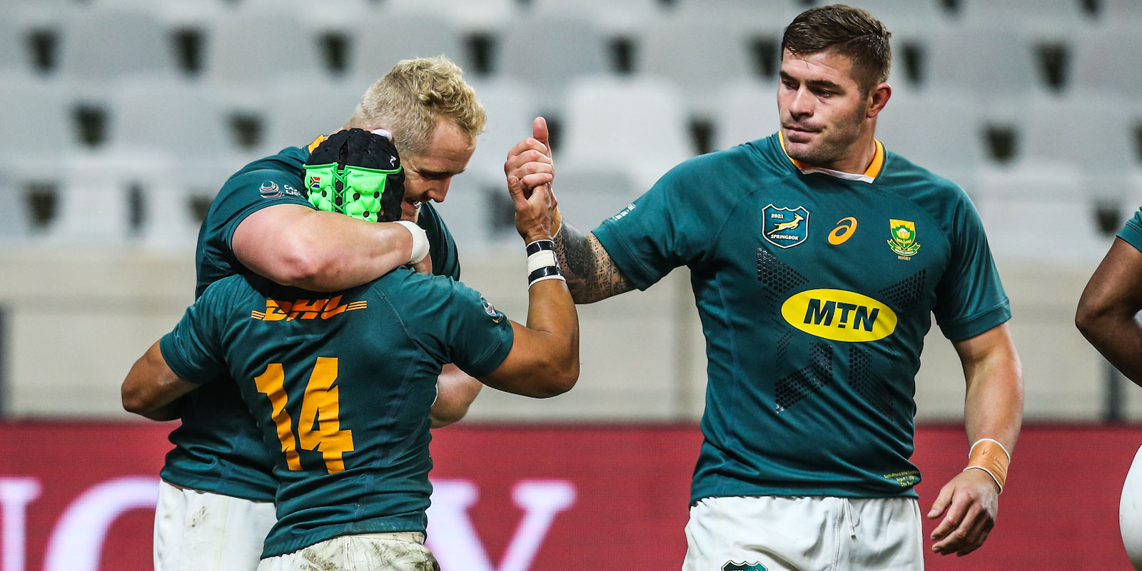 Malcolm Marx (right) and Vincent Koch congratulate Cheslin Kolbe with his try in the third Test.